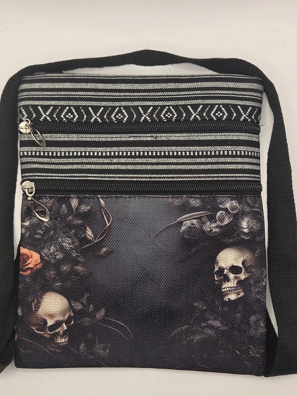 Gothic-style skull and rose print crossbody bag